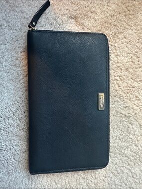 kate spade black zip-around wristlet clutch with gold logo